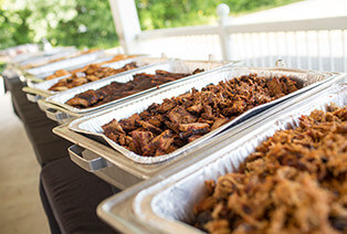Multiple platters of barbecued meat from Famous Dave's BBQ catering delivery