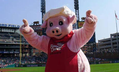 Pig Mascot Famous Dave's at a baseball field