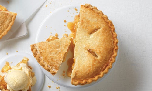 An Apple Pie topped with a sugared crust