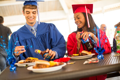 Graduates eating Famous Dave's BBQ