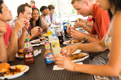 People having a party eating Famous Dave's BBQ